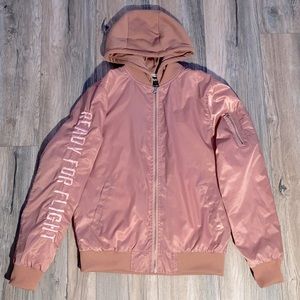 Windbreaker (READY FOR FLIGHT) on the right arm.